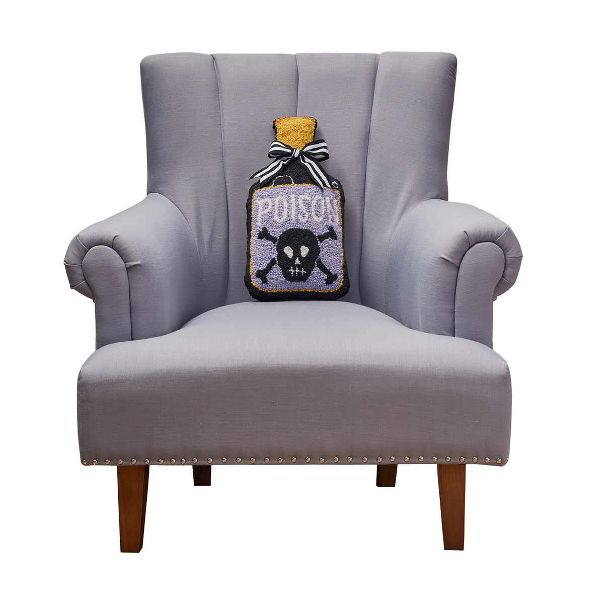 Shaped Poison Bottle Hooked Wool Halloween Throw Pillow on an armchair, showing the throw pillow at room scale, 9x16 inch