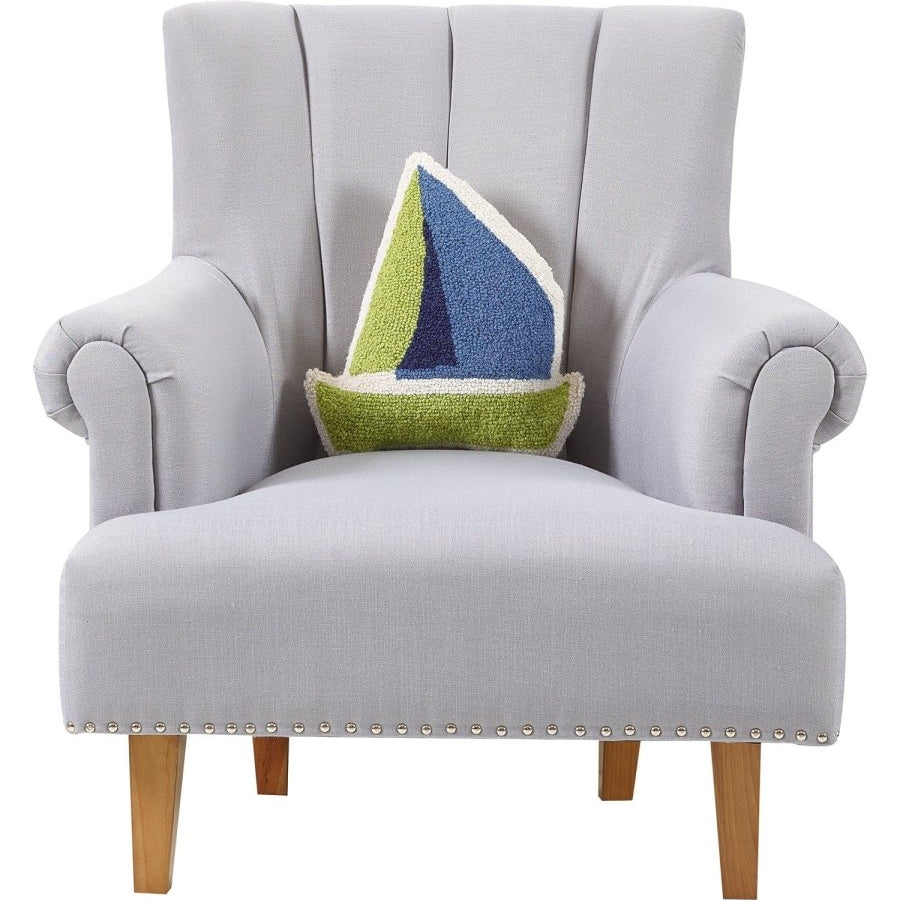 Shaped Sailboat Hooked Wool Throw Pillow on an armchair, showing the throw pillow at room scale, 14x14 inch