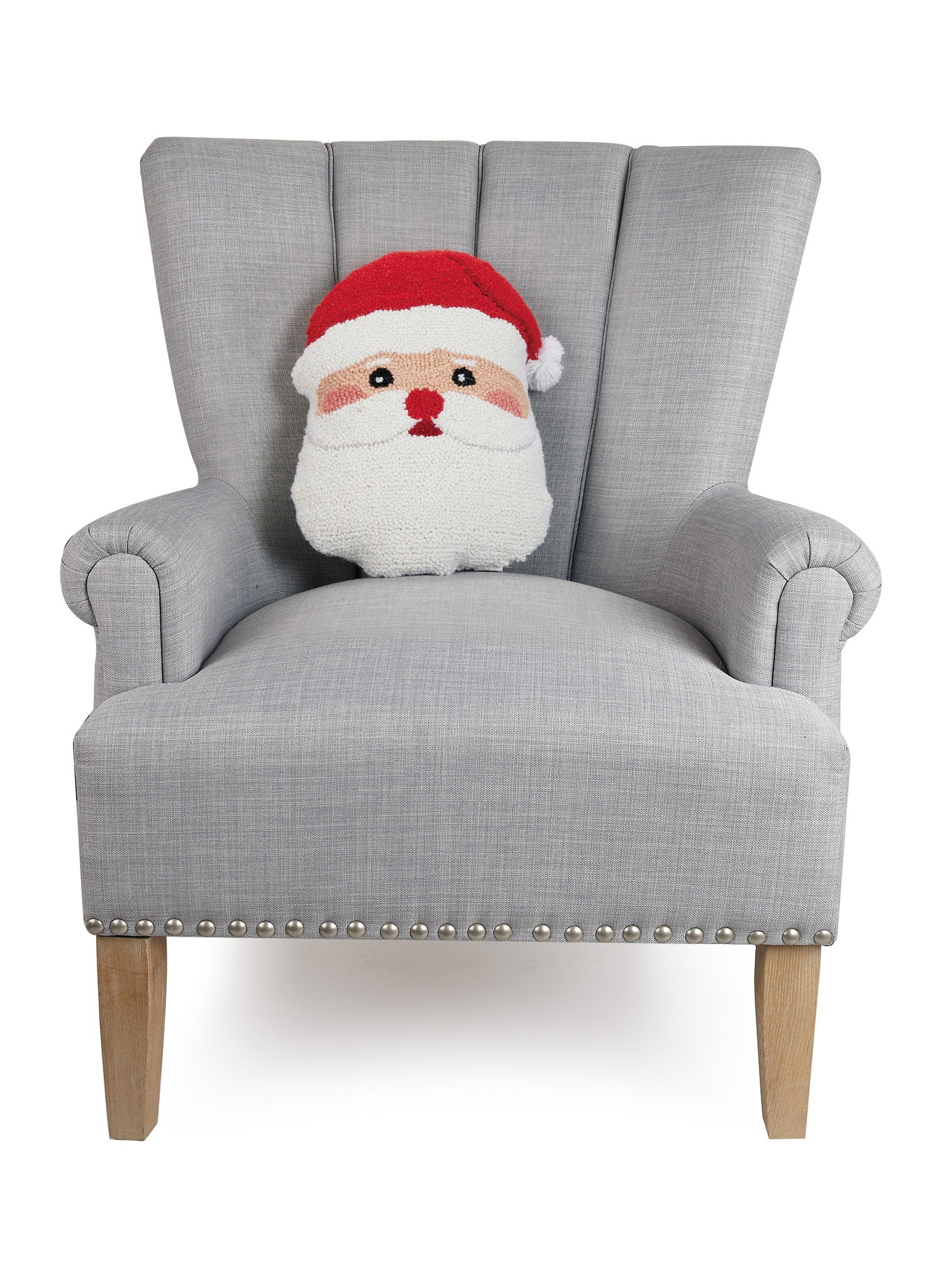 Shaped Santa Face Hooked Wool Christmas Throw Pillow on an armchair, showing the throw pillow at room scale, 12x16 inch