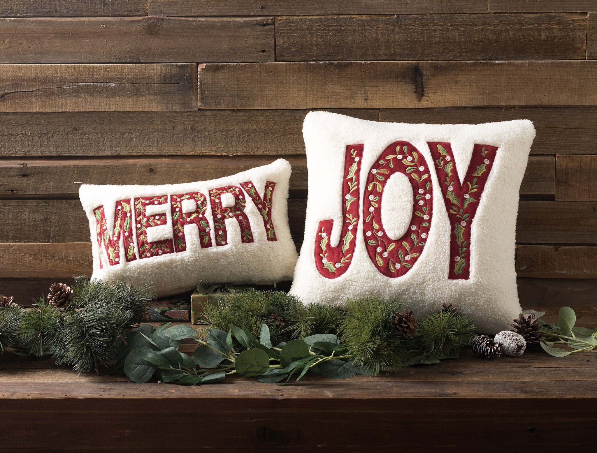 Sherpa Joy Embroidered Christmas Throw Pillow shown alongside other designs in the same collection, 16x16 inch