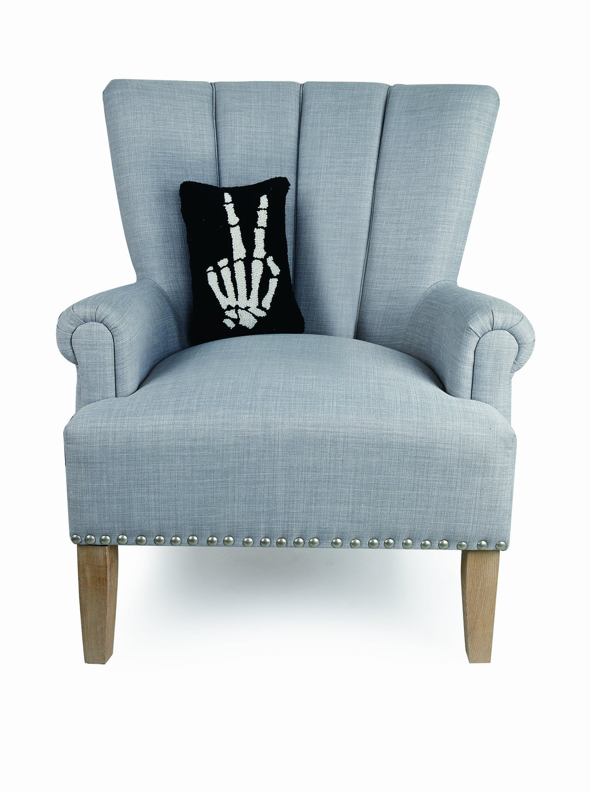 Skeleton Peace Hooked Wool Halloween Throw Pillow on an armchair, showing the throw pillow at room scale, 8x12 inch