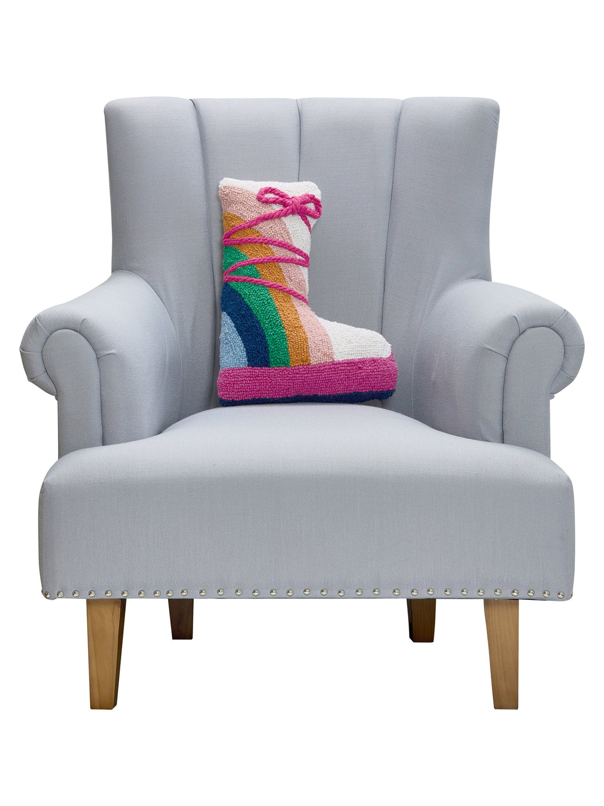 Ski Boot Hooked Wool Christmas Throw Pillow on an armchair, showing the throw pillow at room scale, 12x16 inch