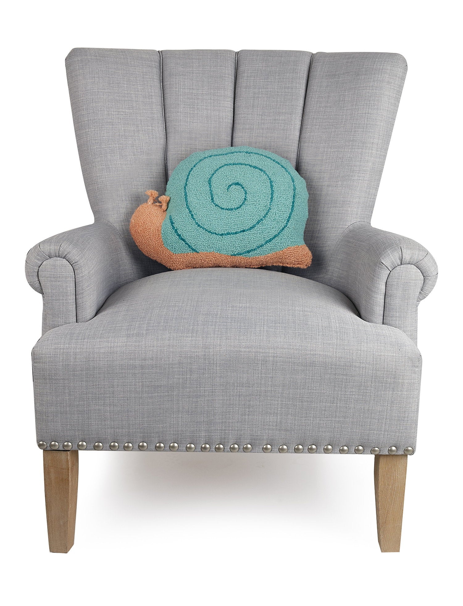 Snail Shaped Hooked Wool Throw Pillow on an armchair, showing the throw pillow at room scale, 12x16 inch
