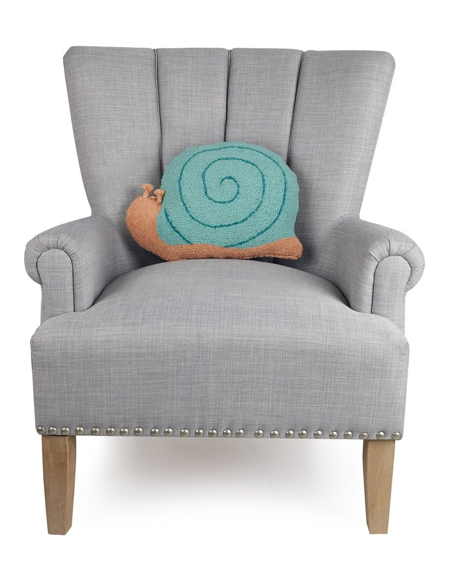 Snail Shaped Hooked Wool Throw Pillow on an armchair, showing the throw pillow at room scale, 12x16 inch
