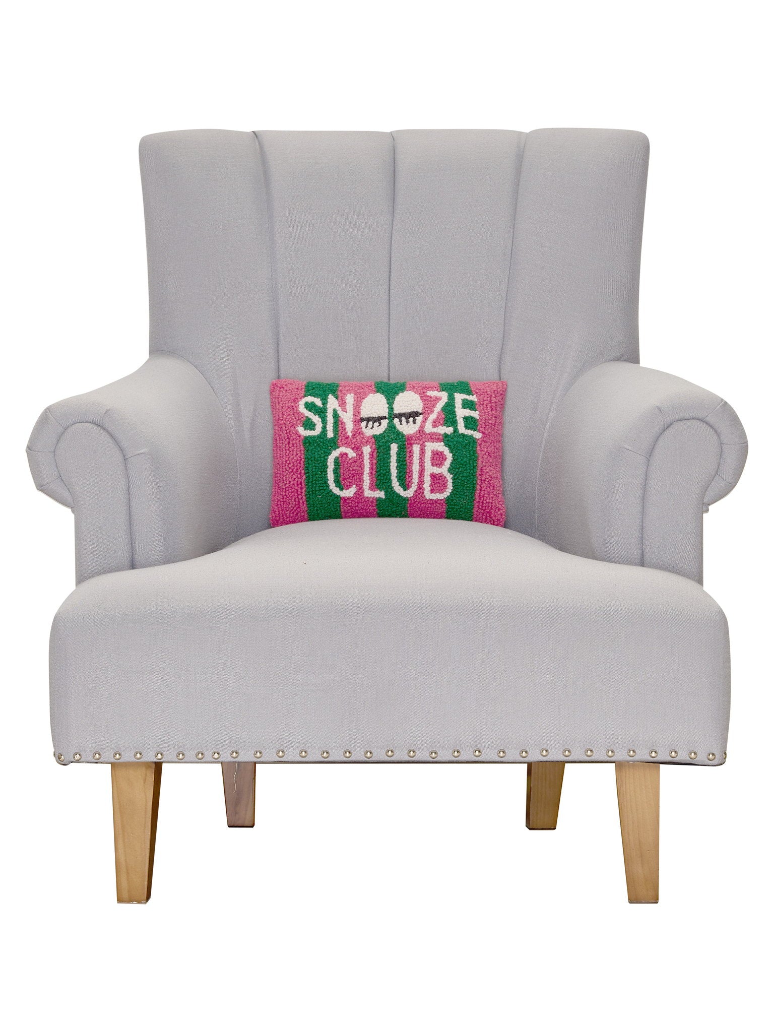 Snooze Club Hooked Wool Throw Pillow on an armchair, showing the throw pillow at room scale, 8x12 inch