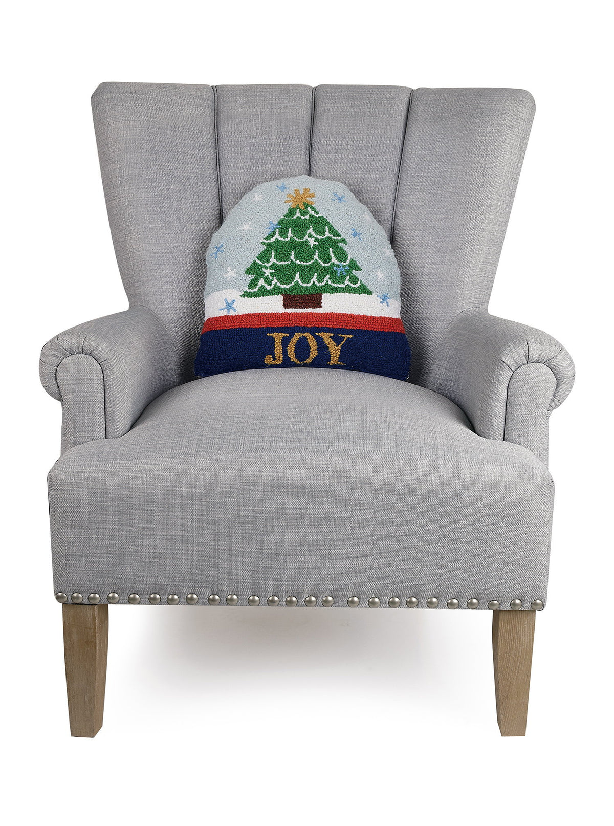 Snow Globe Shaped Hooked Wool Christmas Throw Pillow on an armchair, showing the throw pillow at room scale, 14x14 inch