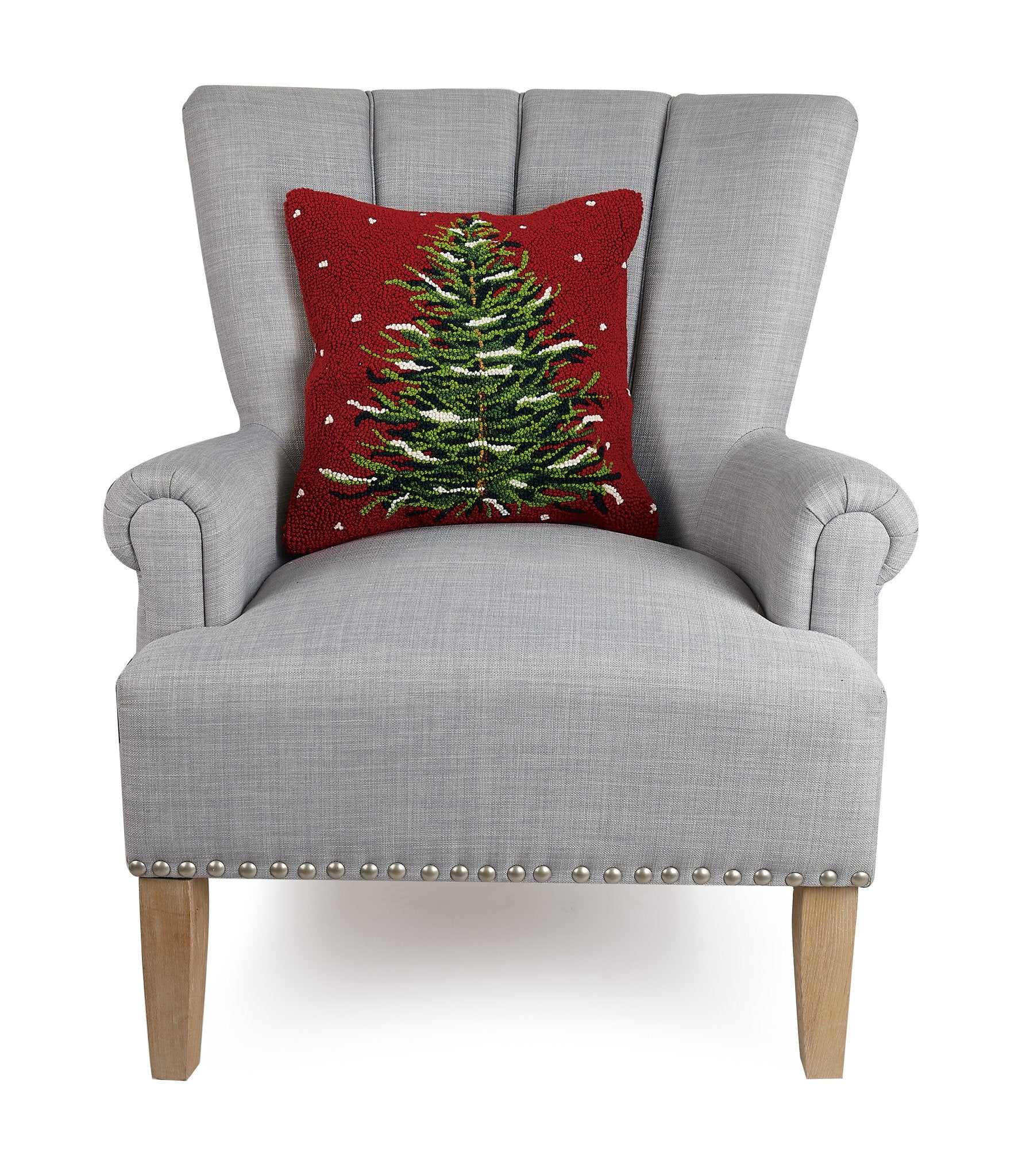 Snowy Evergreen Christmas Tree Hooked Wool Throw Pillow on an armchair, showing the throw pillow at room scale, 16x16 inch