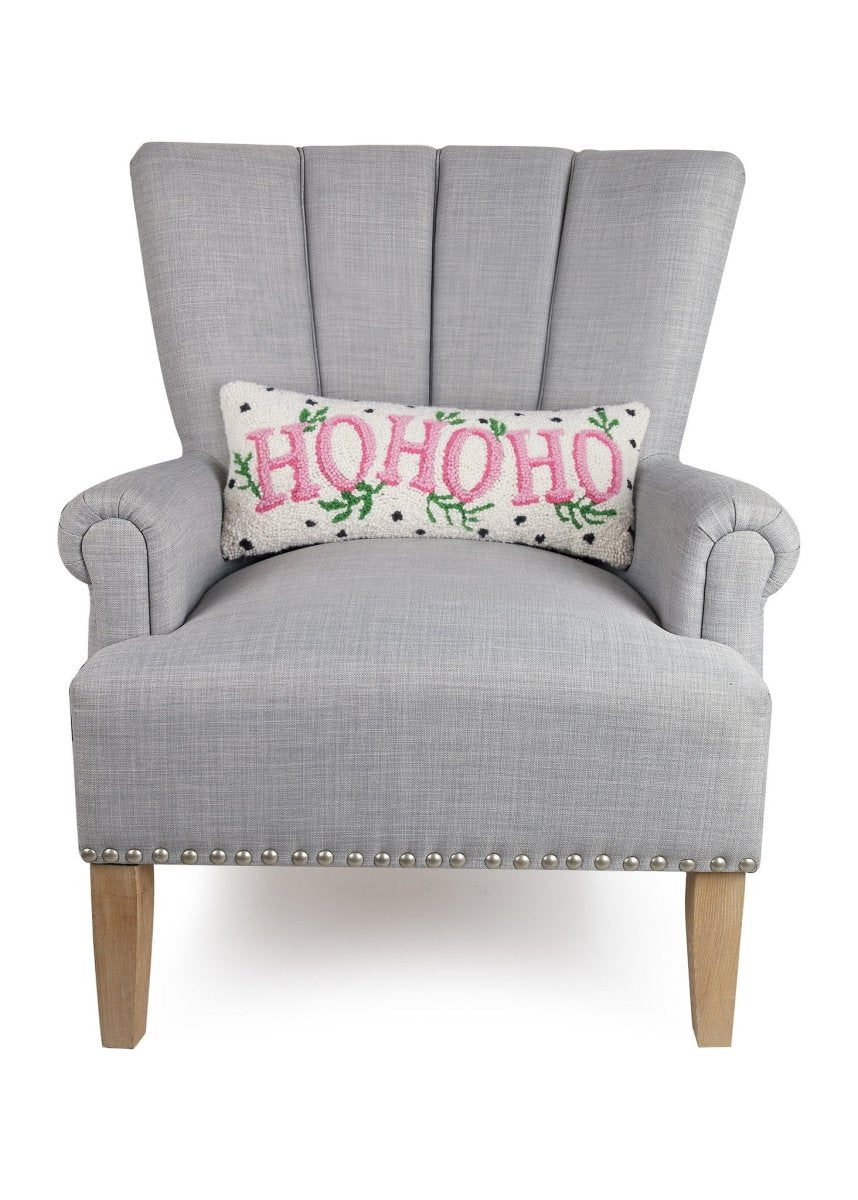 Spotted Holiday Ho Ho Ho Hooked Wool Christmas Throw Pillow on an armchair, showing the throw pillow at room scale, 8x20 inch