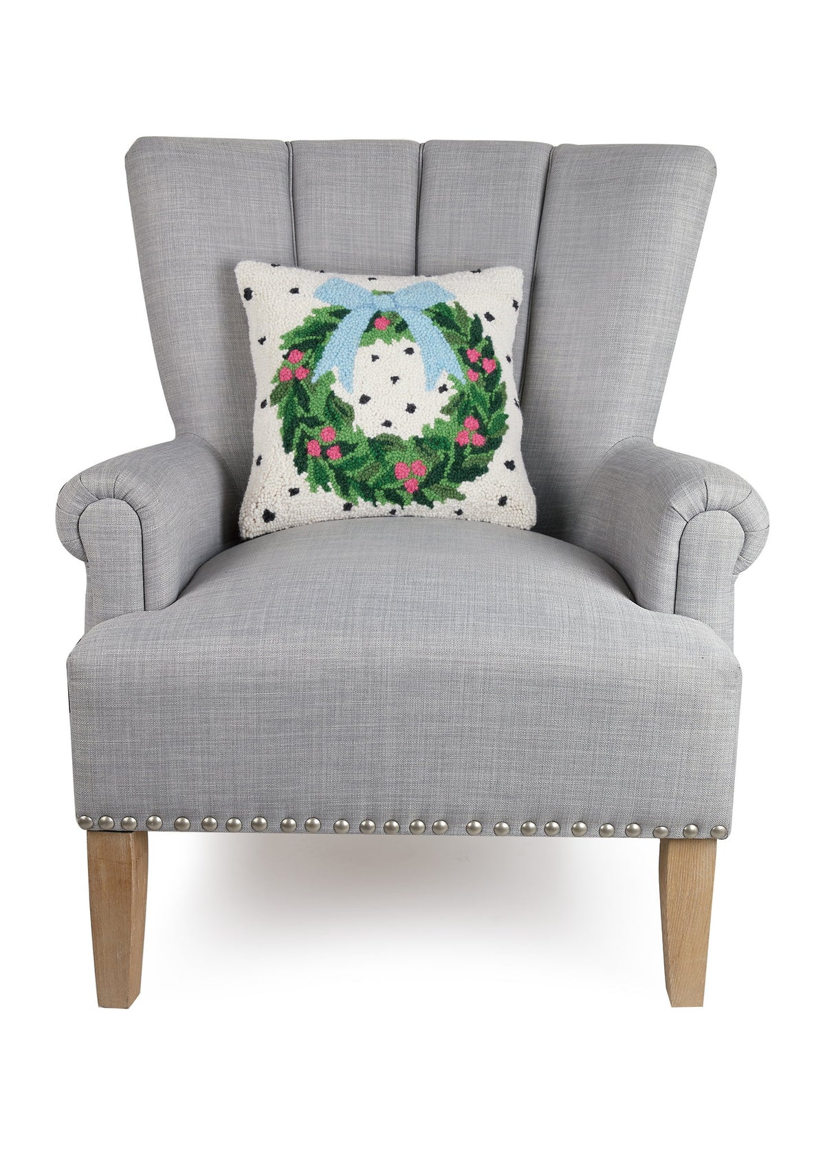 Spotted Holiday Wreath Hooked Wool Christmas Throw Pillow on an armchair, showing the throw pillow at room scale, 14x14 inch