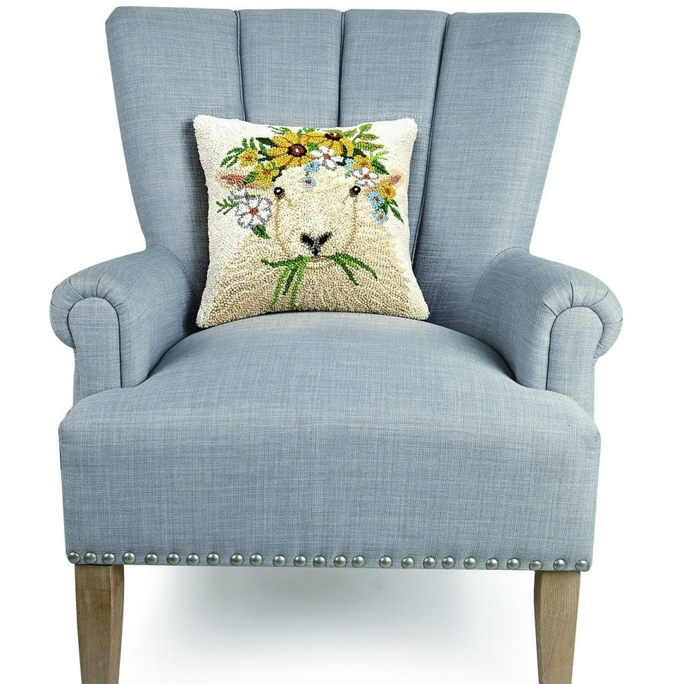 Spring Sheep Hooked Wool Throw Pillow on an armchair, showing the throw pillow at room scale, 14x14 inch