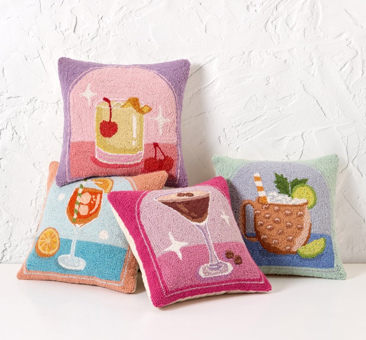 Spritz Hooked Wool Throw Pillow shown alongside other designs in the same collection, 16x16 inch