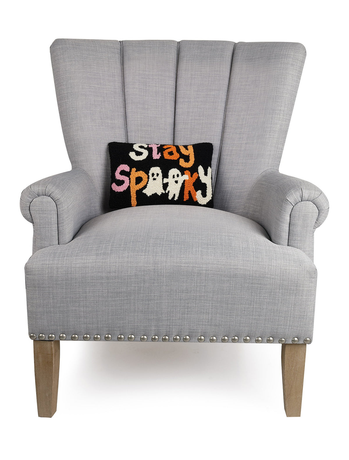 Stay Spooky Hooked Wool Halloween Throw Pillow on an armchair, showing the throw pillow at room scale, 8x12 inch