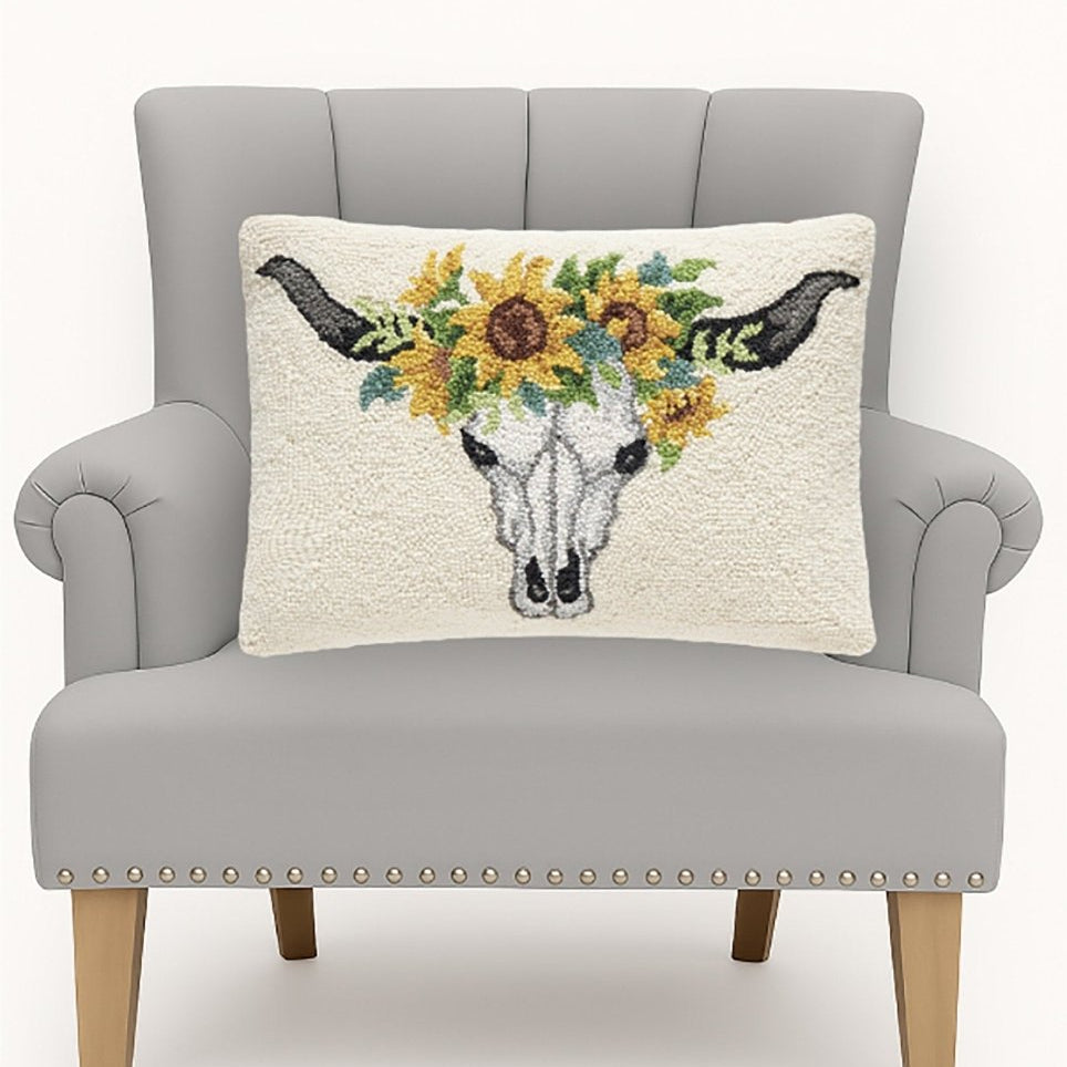 Sunflower Skull Hooked Wool Halloween Throw Pillow on an armchair, showing the throw pillow at room scale, 14x20 inch