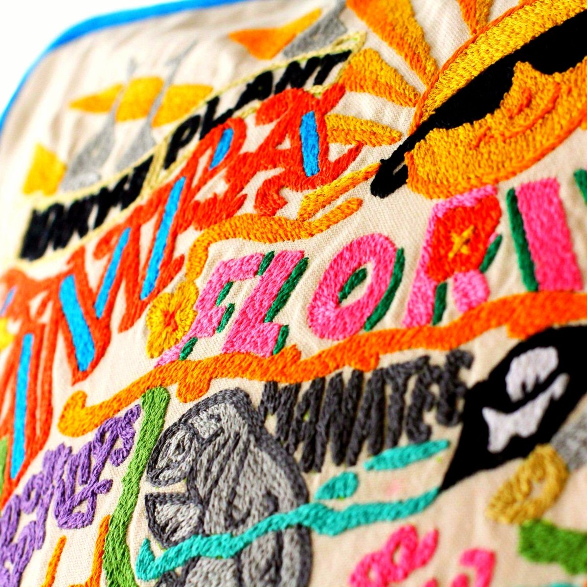 Tampa St Pete Gulf Coast Embroidered Travel Pillow - close-up detail of hand-embroidered needlepoint stitching