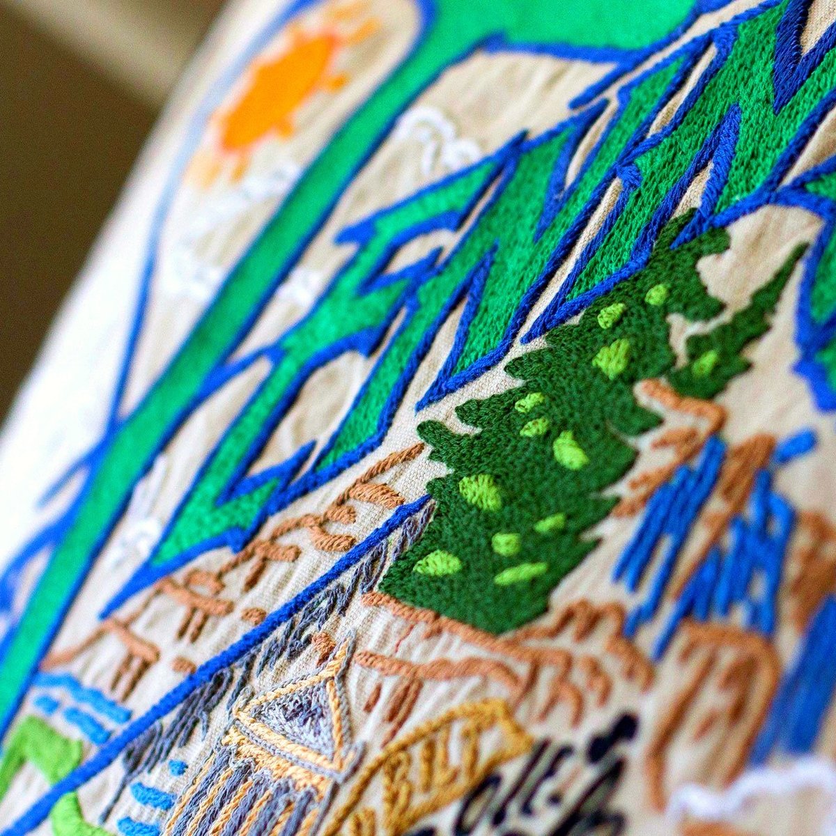 Tennessee Music City Travel XL Embroidered Throw Pillow - close-up detail of hand-embroidered needlepoint stitching