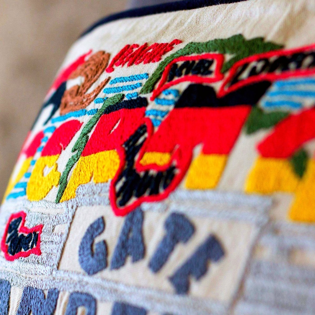 Traditional Germany Embroidered Travel Throw Pillow - close-up detail of hand-embroidered needlepoint stitching