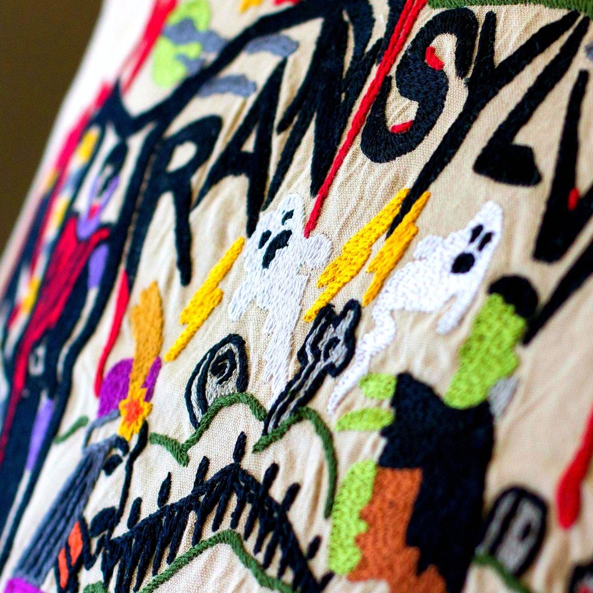 Transylvania Scary Halloween Travel Embroidered Pillow - close-up detail of hand-embroidered needlepoint stitching