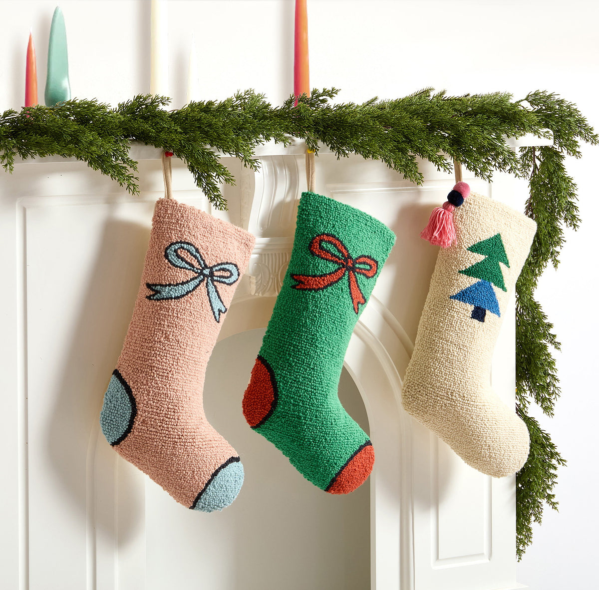 Tree with Tassel Hooked Wool Christmas Stocking shown alongside other designs in the same collection, 12x20 inch