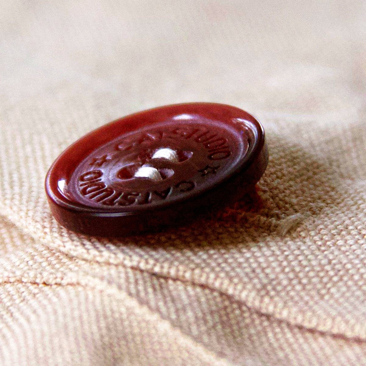 Utah Wasatch Range Embroidered Ski Lodge Pillow - detail of decorative button closure