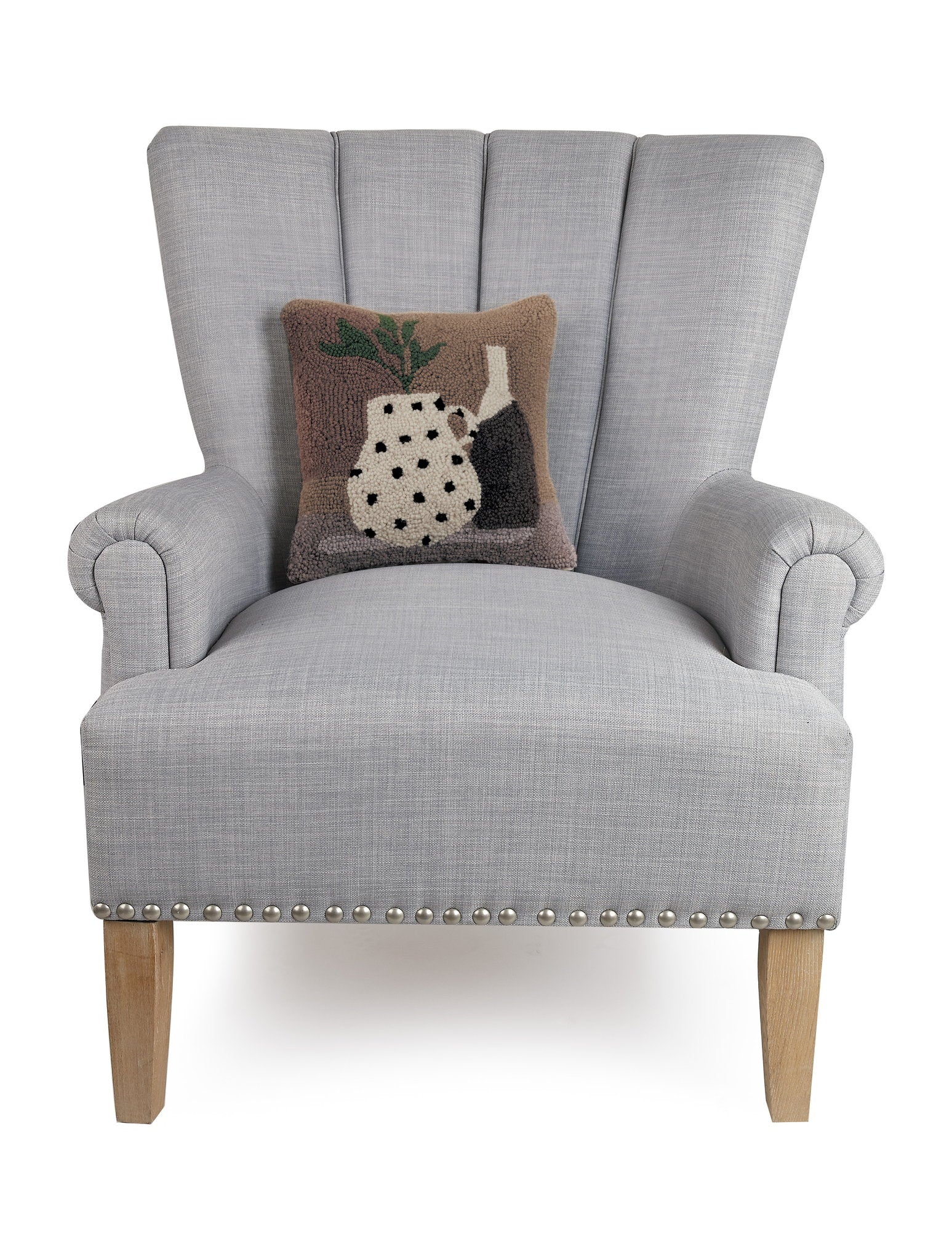 Vase and Plant Hooked Wool Throw Pillow on an armchair, showing the throw pillow at room scale, 12x12 inch