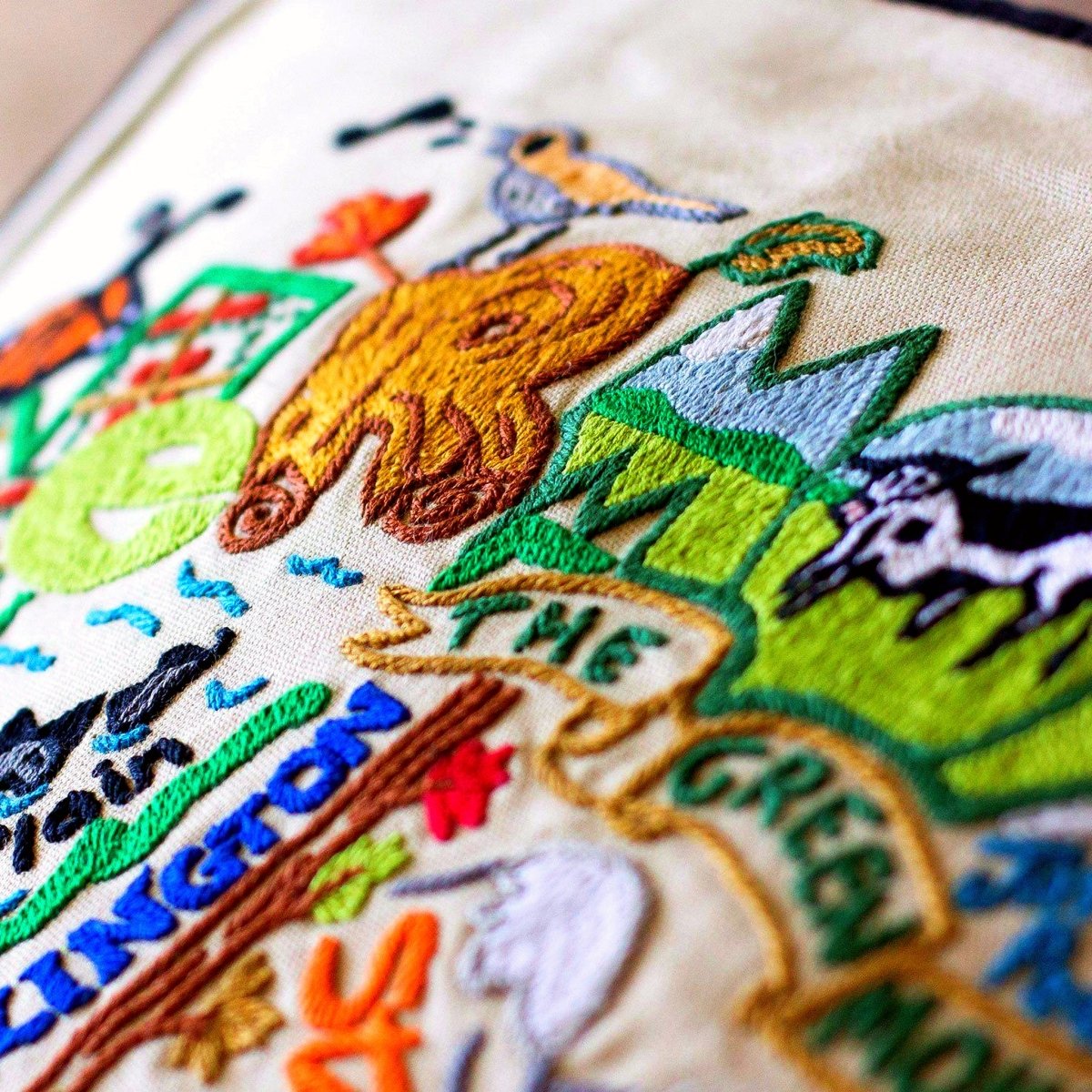 Vermont State Green Mountains Travel Embroidered Throw Pillow - close-up detail of hand-embroidered needlepoint stitching