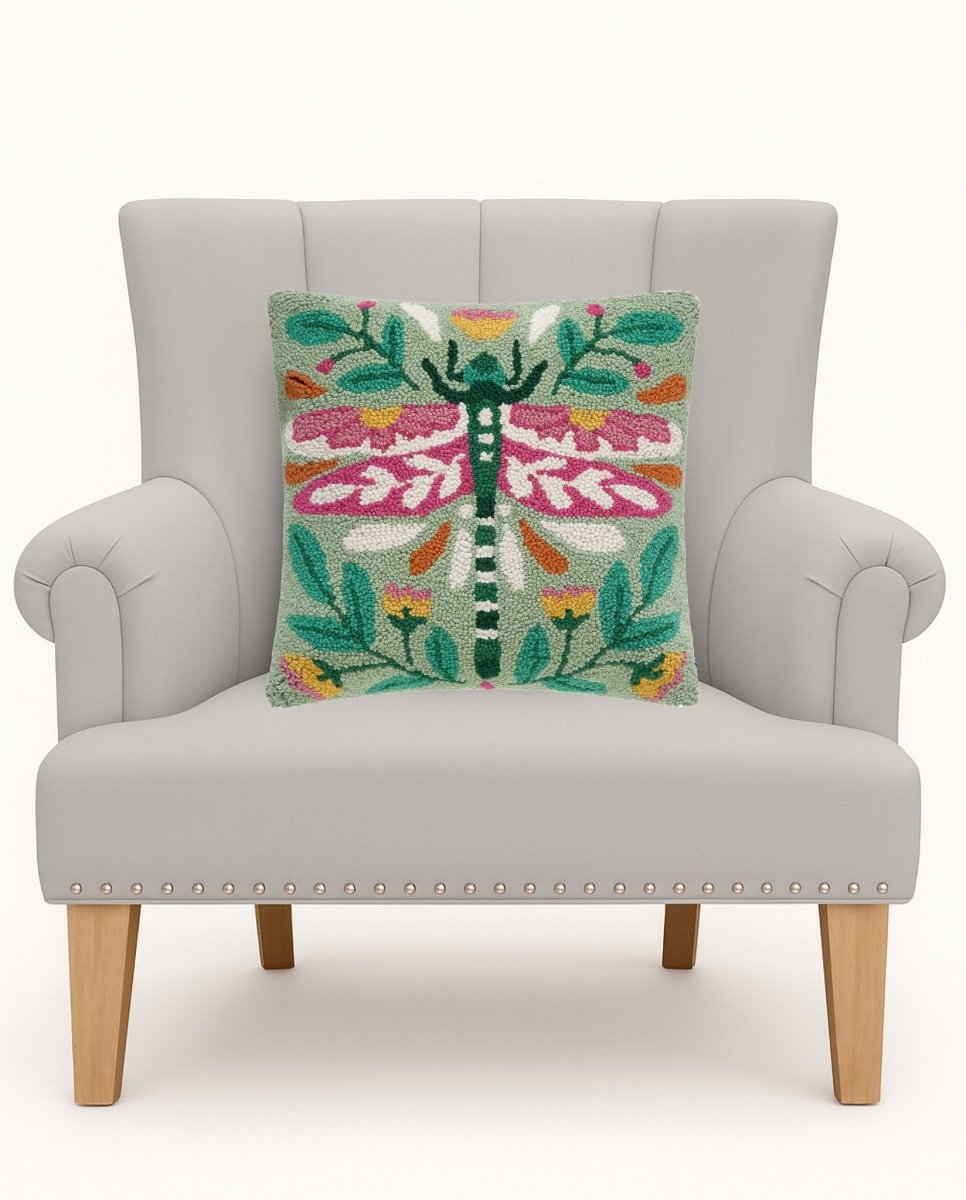 Vintage Floral Tile Lumber Hooked Wool Throw Pillow on an armchair, showing the throw pillow at room scale, 9x16 inch