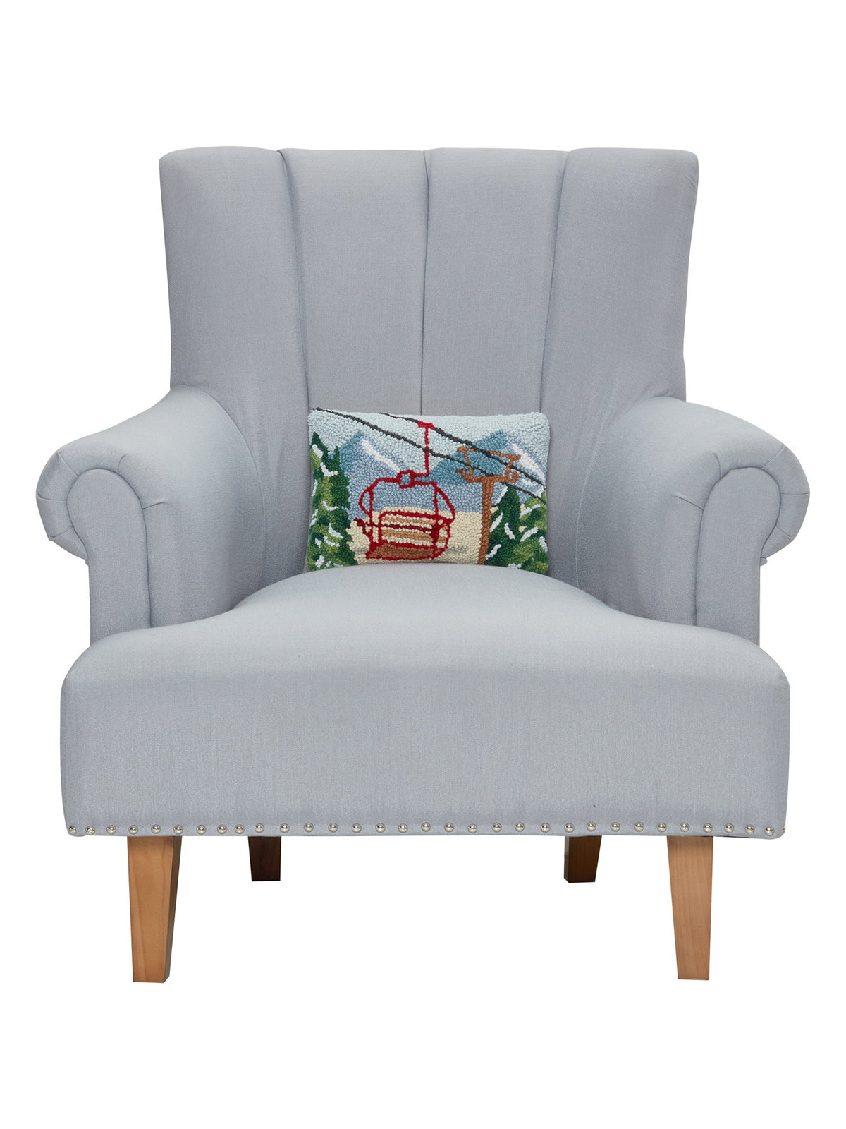 Vintage Gondola Hooked Wool Christmas Throw Pillow on an armchair, showing the throw pillow at room scale, 8x12 inch