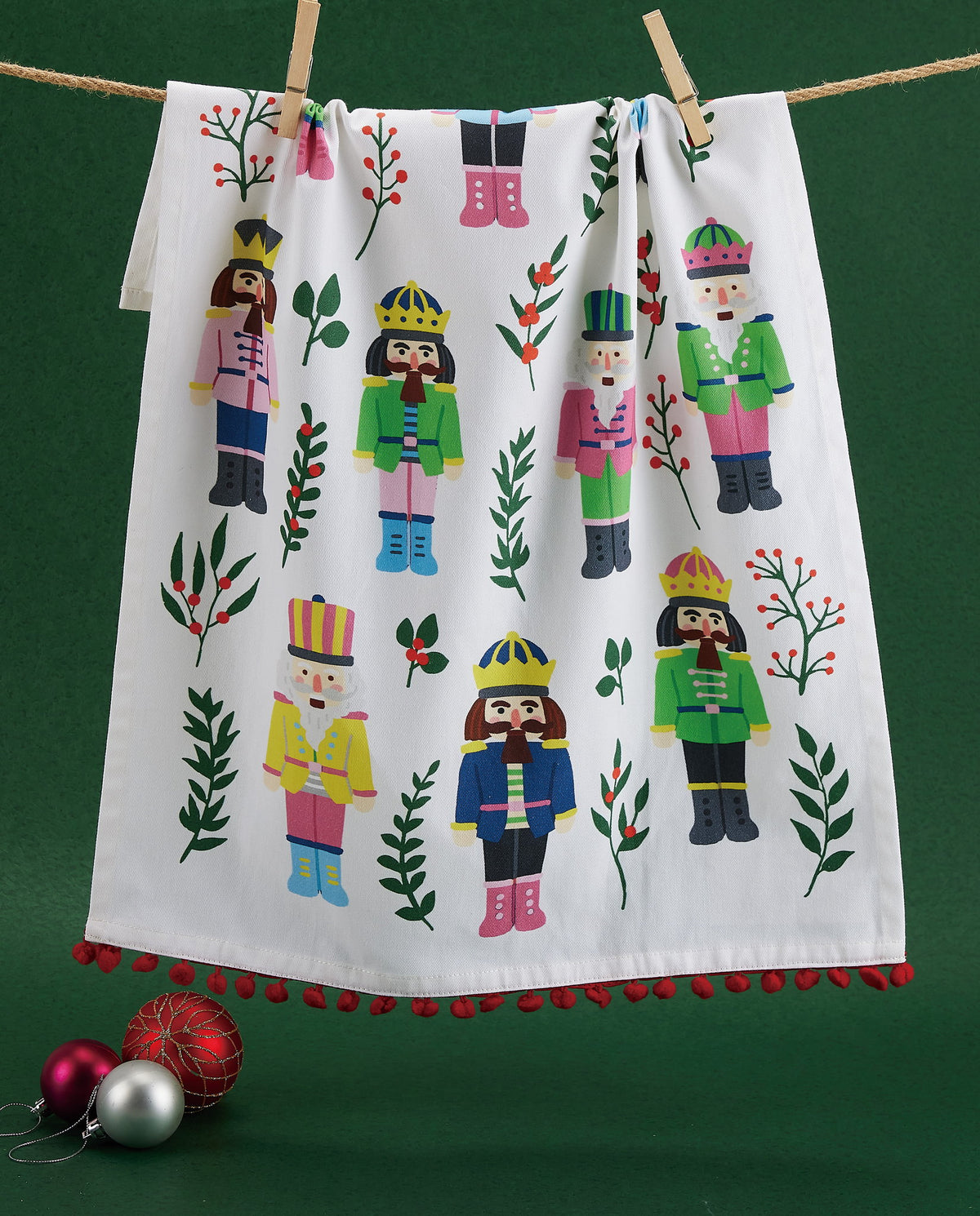 Vintage Nutcrackers with Pom Pom Printed Christmas Kitchen Towel styled in a room setting, 18x25 inch