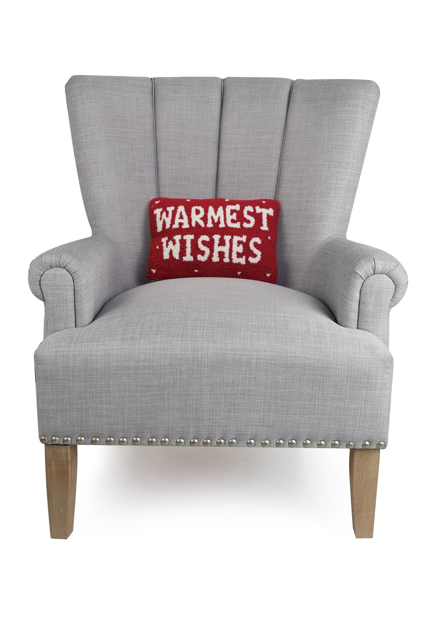 Warmest Wishes Hooked Wool Christmas Throw Pillow on an armchair, showing the throw pillow at room scale, 8x12 inch