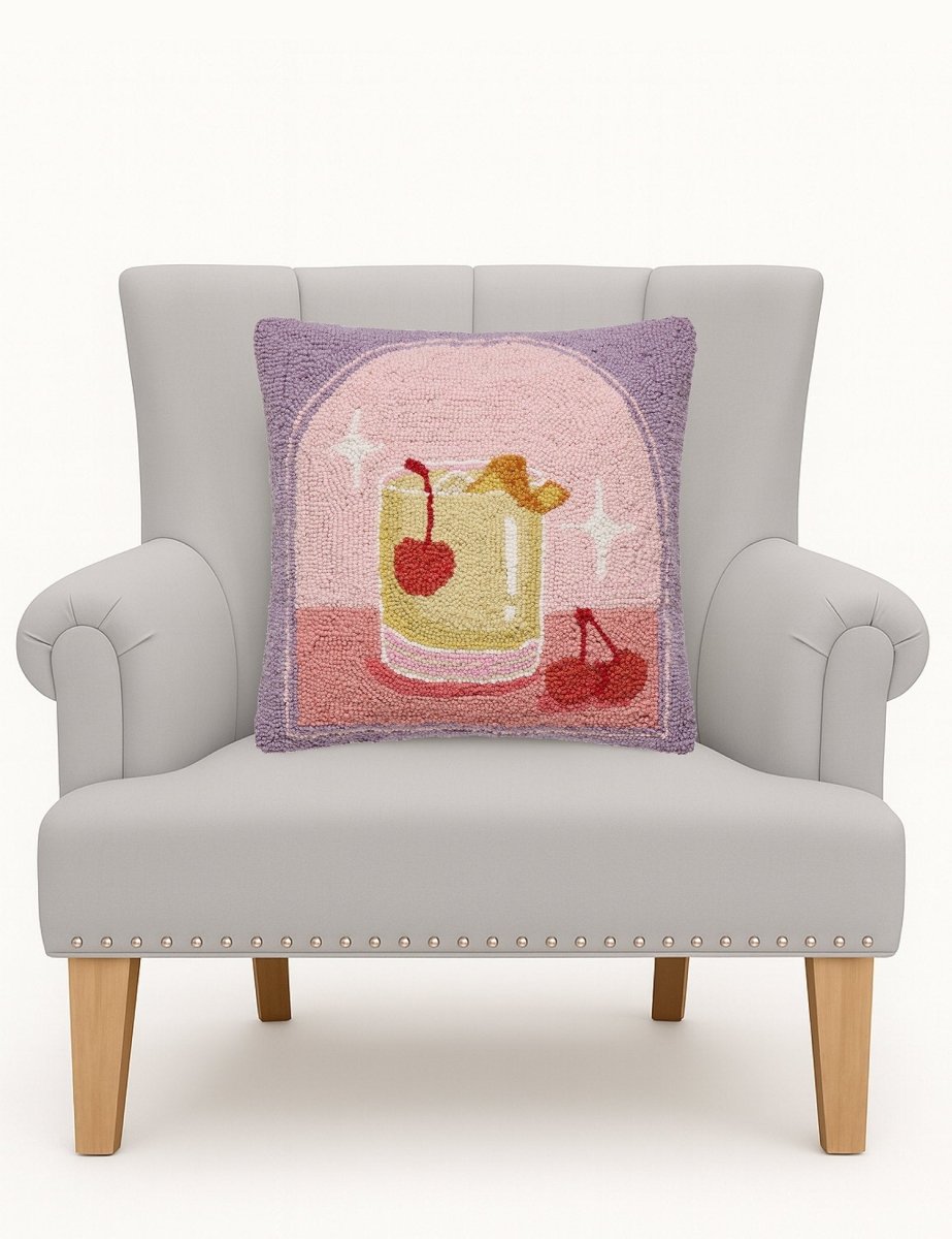 Whiskey Sour Hooked Wool Throw Pillow on an armchair, showing the throw pillow at room scale, 16x16 inch
