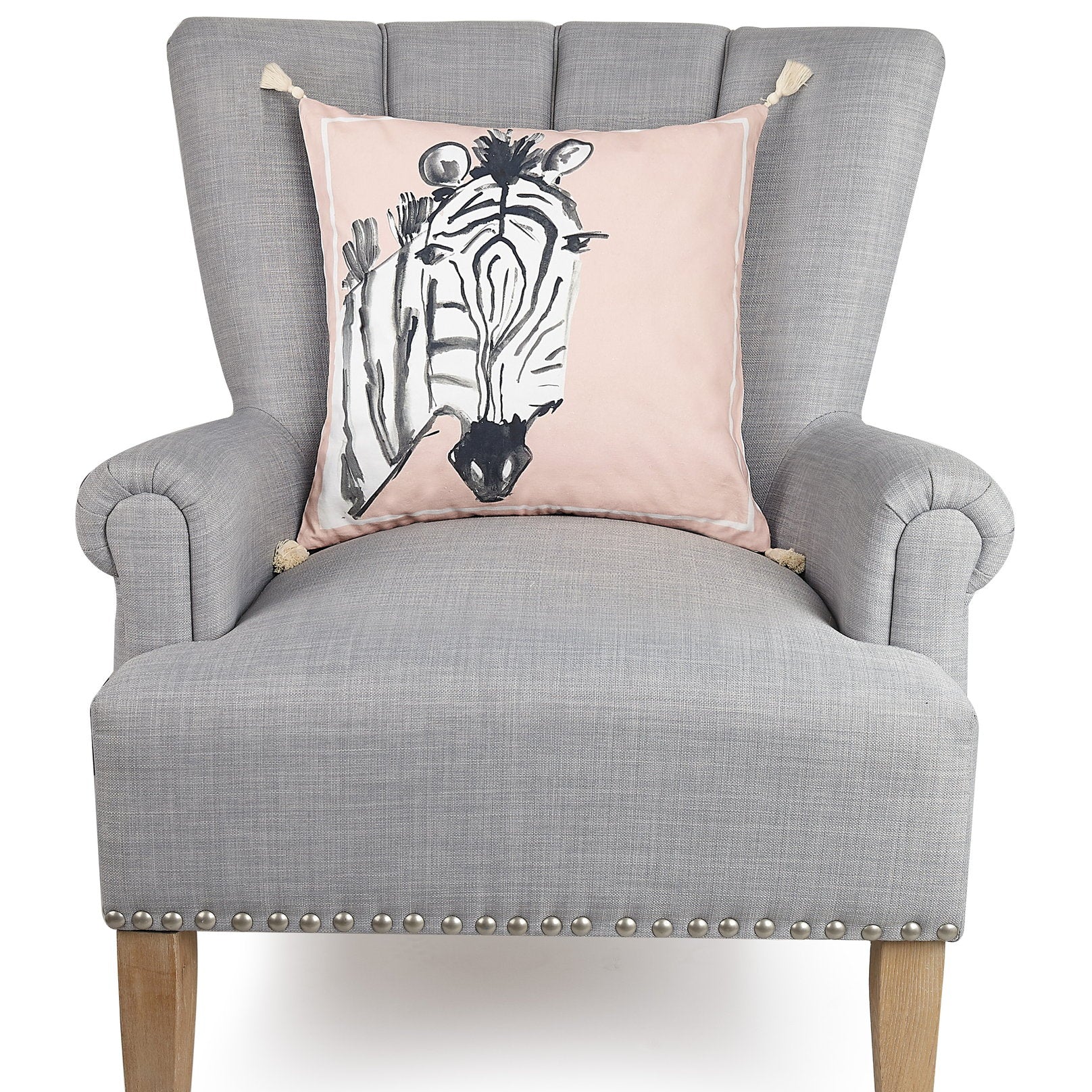 Zebra Embroidered Throw Pillow on an armchair, showing the throw pillow at room scale, 18x18 inch