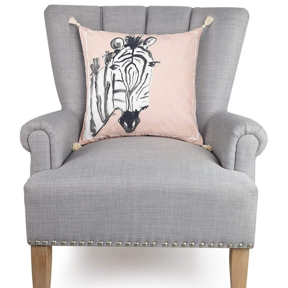 Zebra Embroidered Throw Pillow on an armchair, showing the throw pillow at room scale, 18x18 inch