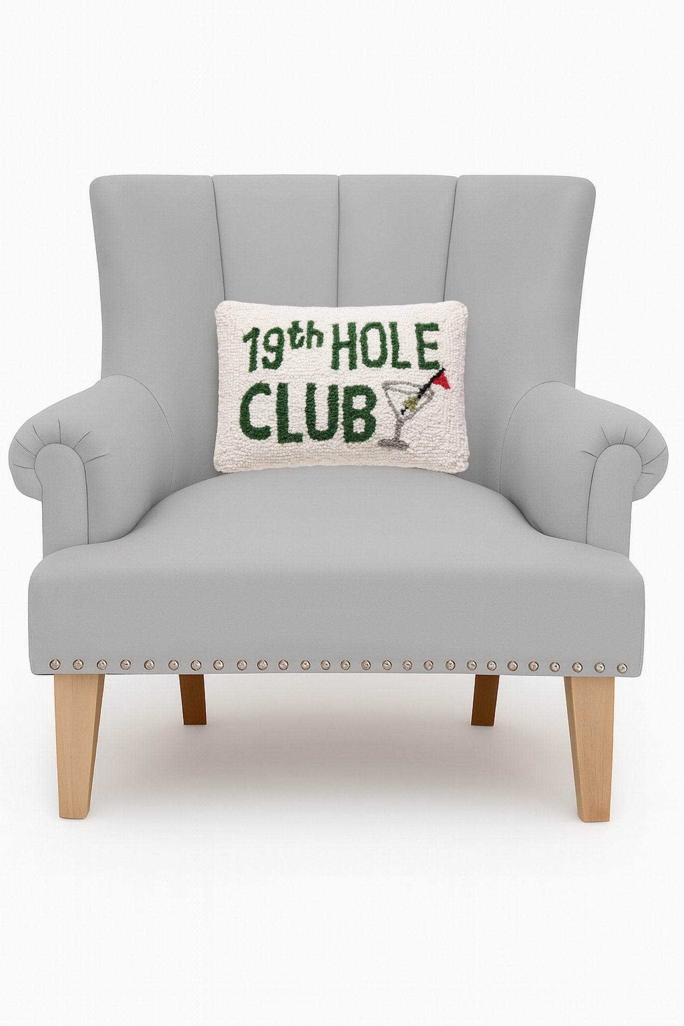 19th Hole Club Hooked Wool Throw Pillow on an armchair, showing the throw pillow at room scale, 8x12 inch