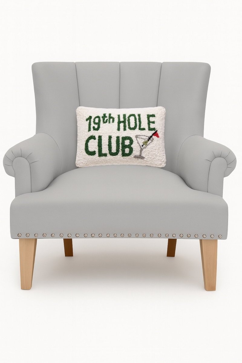 19th Hole Club Hooked Wool Throw Pillow on an armchair, showing the throw pillow at room scale, 8x12 inch