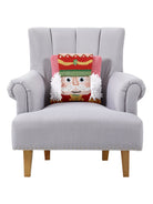 3D Nutcracker Hooked Christmas Throw Pillow on an armchair, showing the throw pillow at room scale, 14x14 inch
