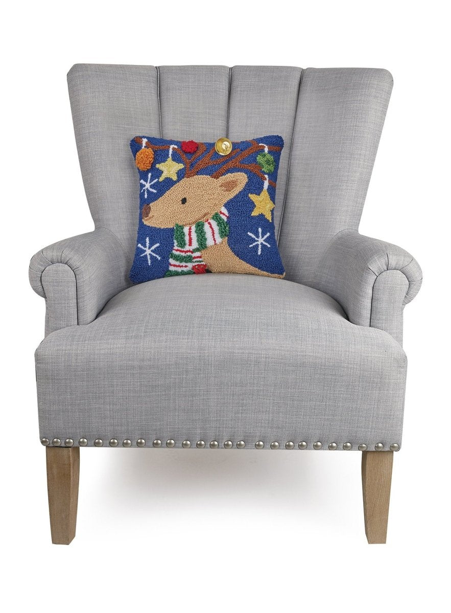 3D Reindeer with Bell Hooked Christmas Throw Pillow on an armchair, showing the throw pillow at room scale, 14x14 inch