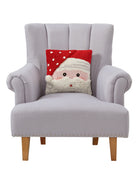 3D Santa Hooked Christmas Throw Pillow on an armchair, showing the throw pillow at room scale, 14x14 inch