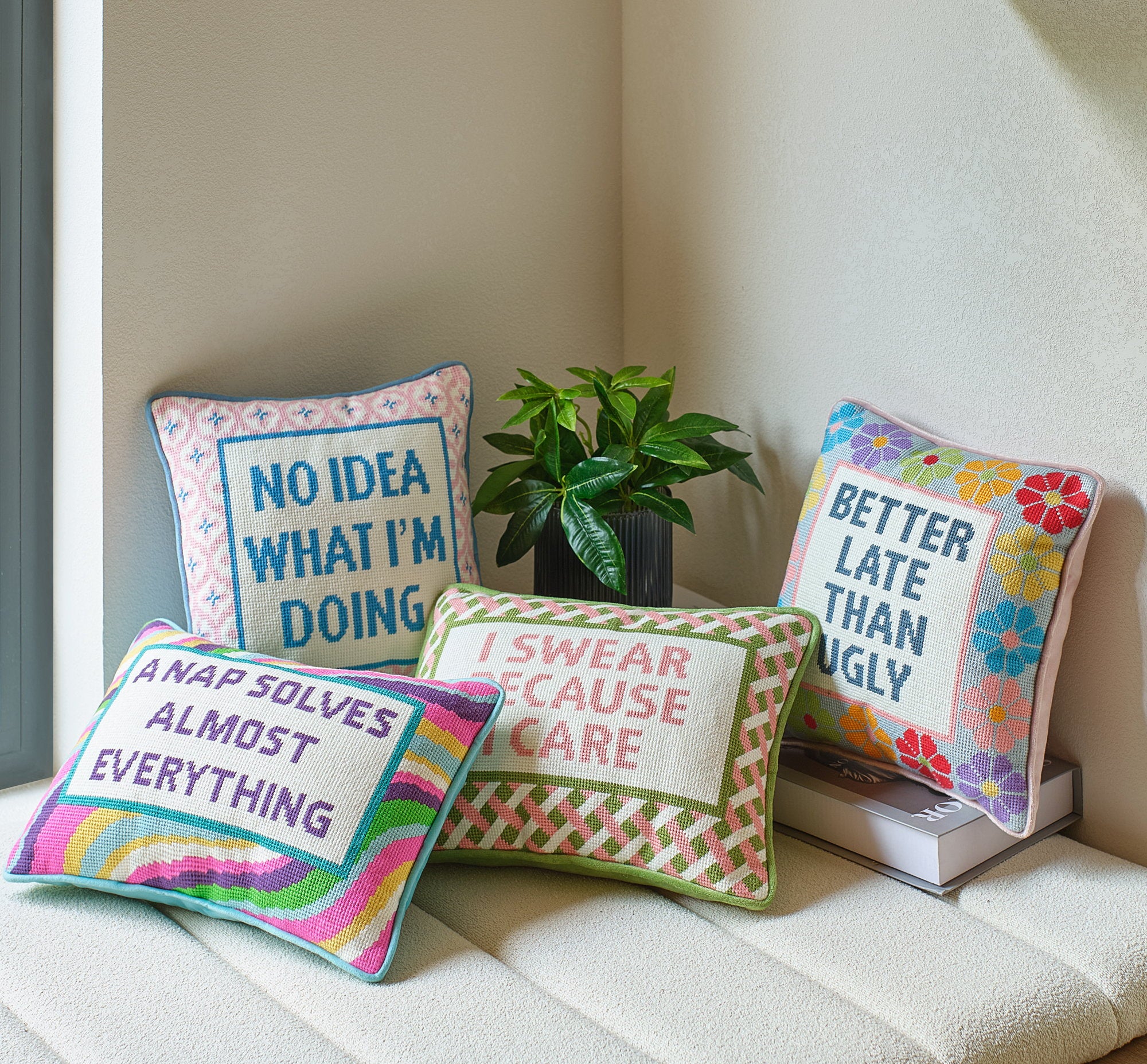 A Nap Solves Almost Embroidered Needlepoint Throw Pillow shown alongside other designs in the same collection, 10x14 inch