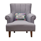 A Nap Solves Almost Embroidered Needlepoint Throw Pillow on an armchair, showing the throw pillow at room scale, 10x14 inch