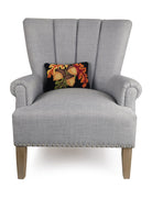 Acorn with Leaves Hooked Wool Fall Harvest Throw Pillow on an armchair, showing the throw pillow at room scale, 8x12 inch