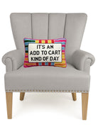 Add to Cart Embroidered Needlepoint Throw Pillow on an armchair, showing the throw pillow at room scale, 10x14 inch