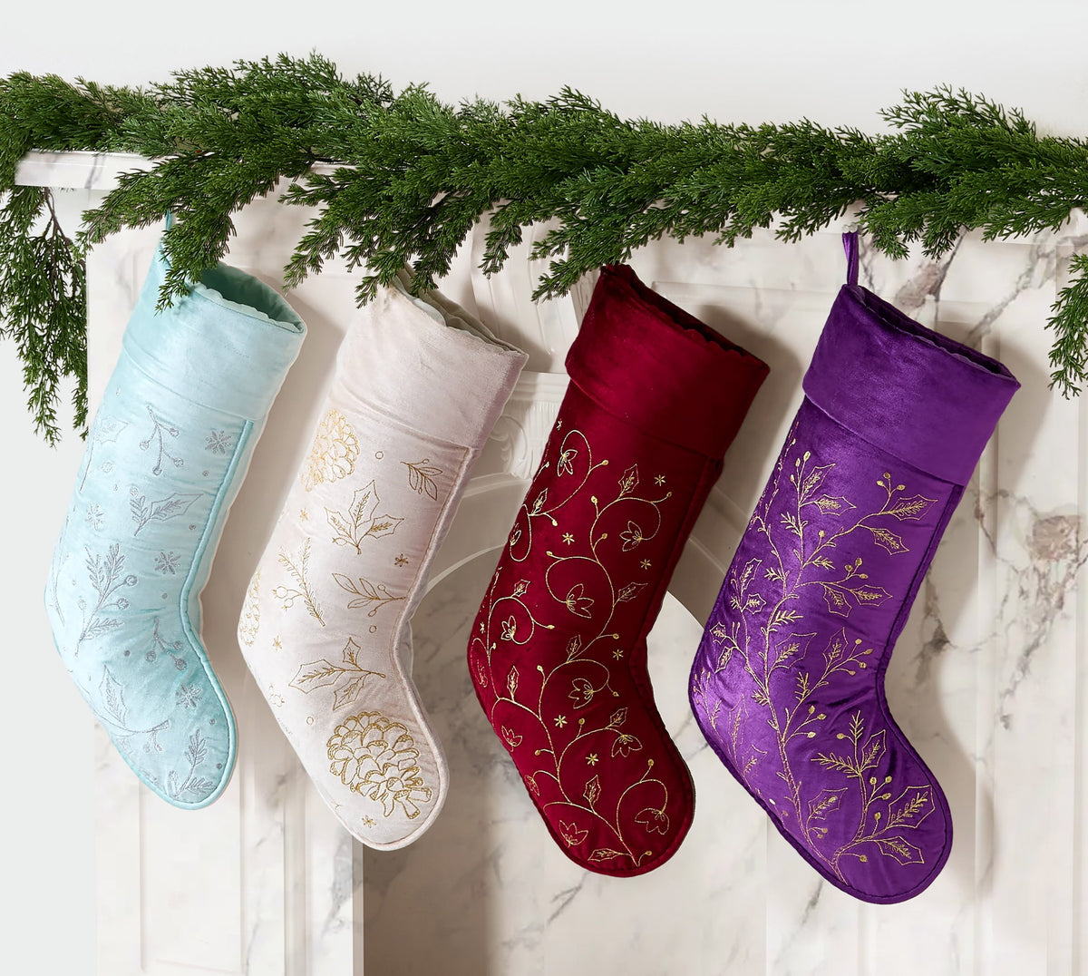 All Over Foliage Embroidered Christmas Stocking shown alongside other designs in the same collection, 12x20 inch