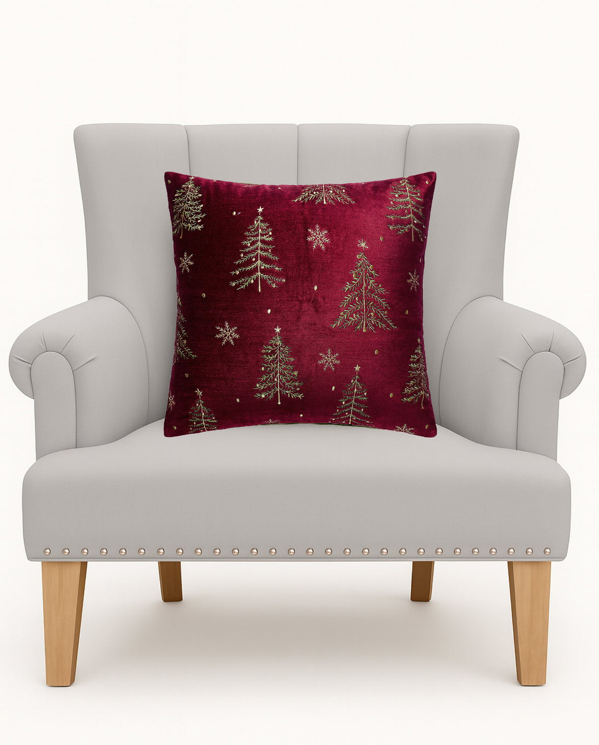 All Over Trees Velvet Embroidered Christmas Throw Pillow on an armchair, showing the throw pillow at room scale, 16x16 inch