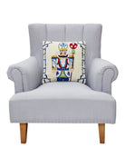 Bamboo Chinoiserie Nutcracker Hooked Wool Christmas Throw Pillow on an armchair, showing the throw pillow at room scale, 16x16 inch