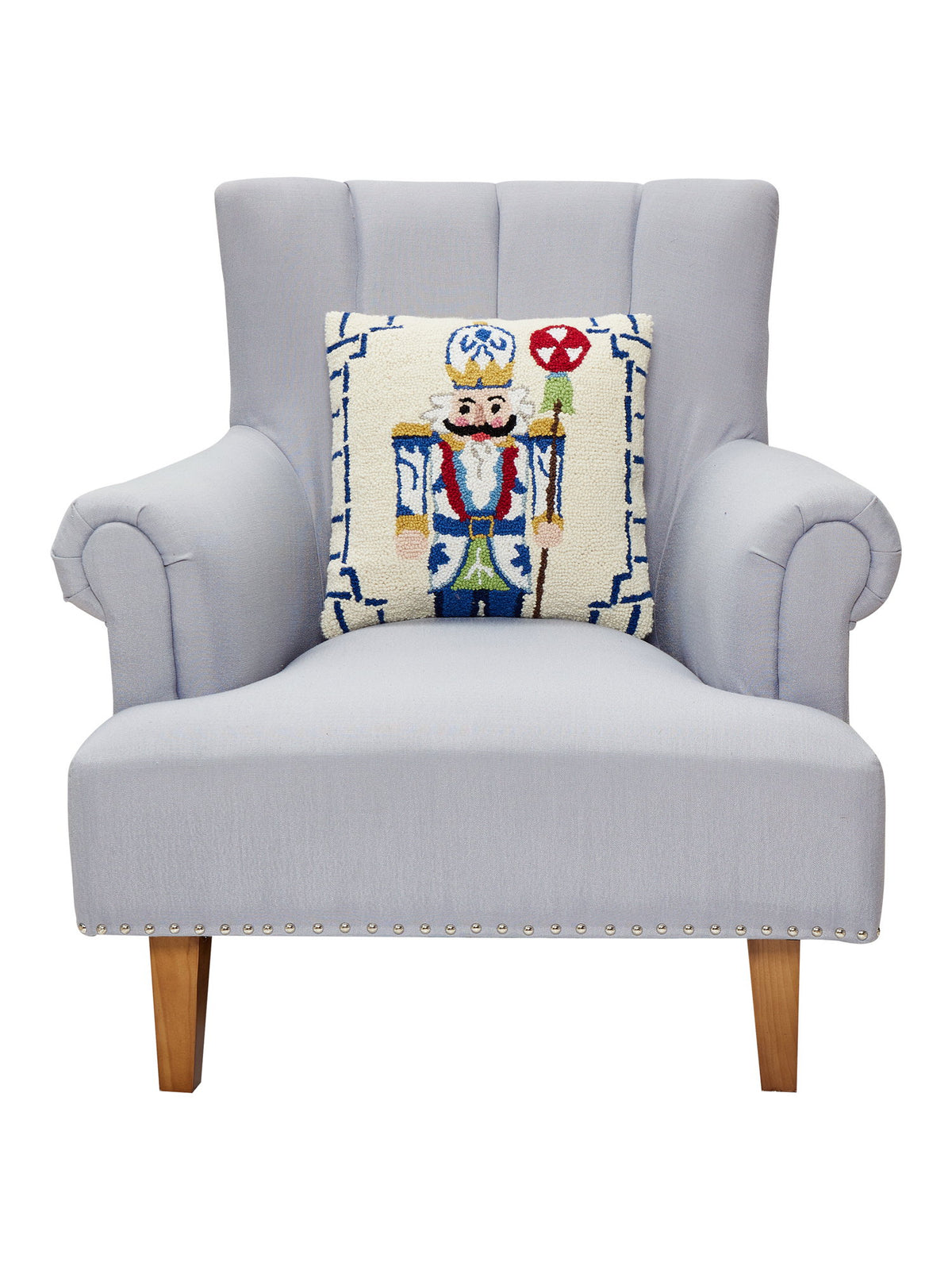 Bamboo Chinoiserie Nutcracker Hooked Wool Christmas Throw Pillow on an armchair, showing the throw pillow at room scale, 16x16 inch