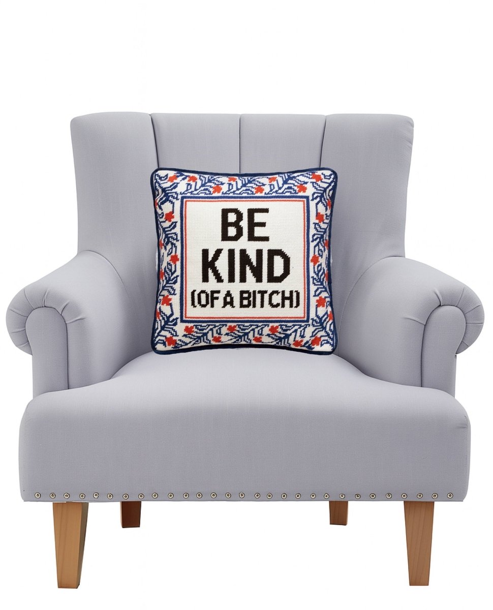 Be Kind (of a Bitch) Embroidered Needlepoint Throw Pillow on an armchair, showing the throw pillow at room scale, 12x12 inch