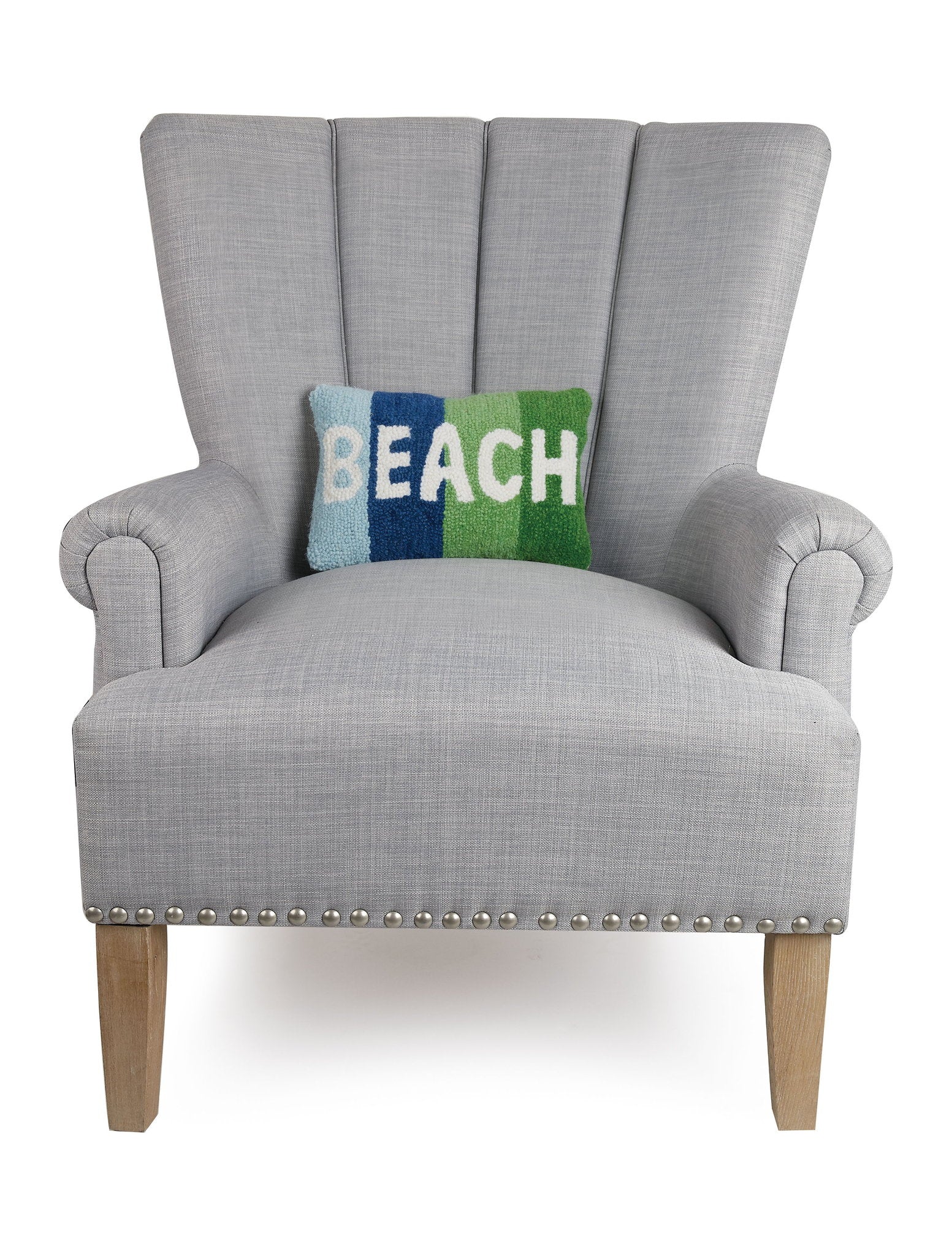 Beach Hooked Wool Throw Pillow on an armchair, showing the throw pillow at room scale, 8x12 inch