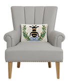 Bee in a Wreath Hooked Wool Throw Pillow on an armchair, showing the throw pillow at room scale, 8x12 inch