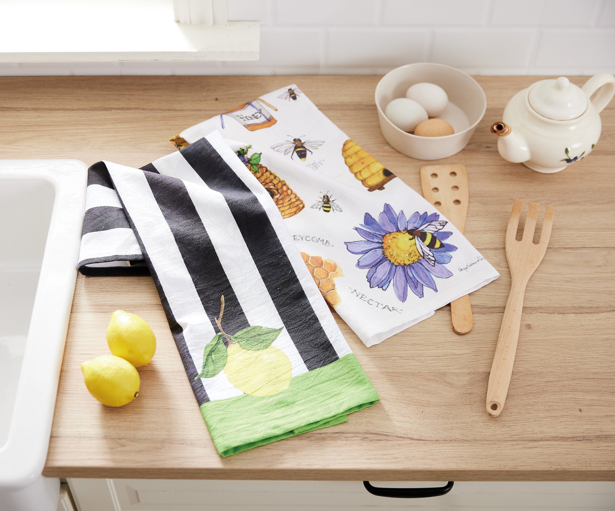 Beehavin Kitchen Towel shown alongside other designs in the same collection, 18x25 inch