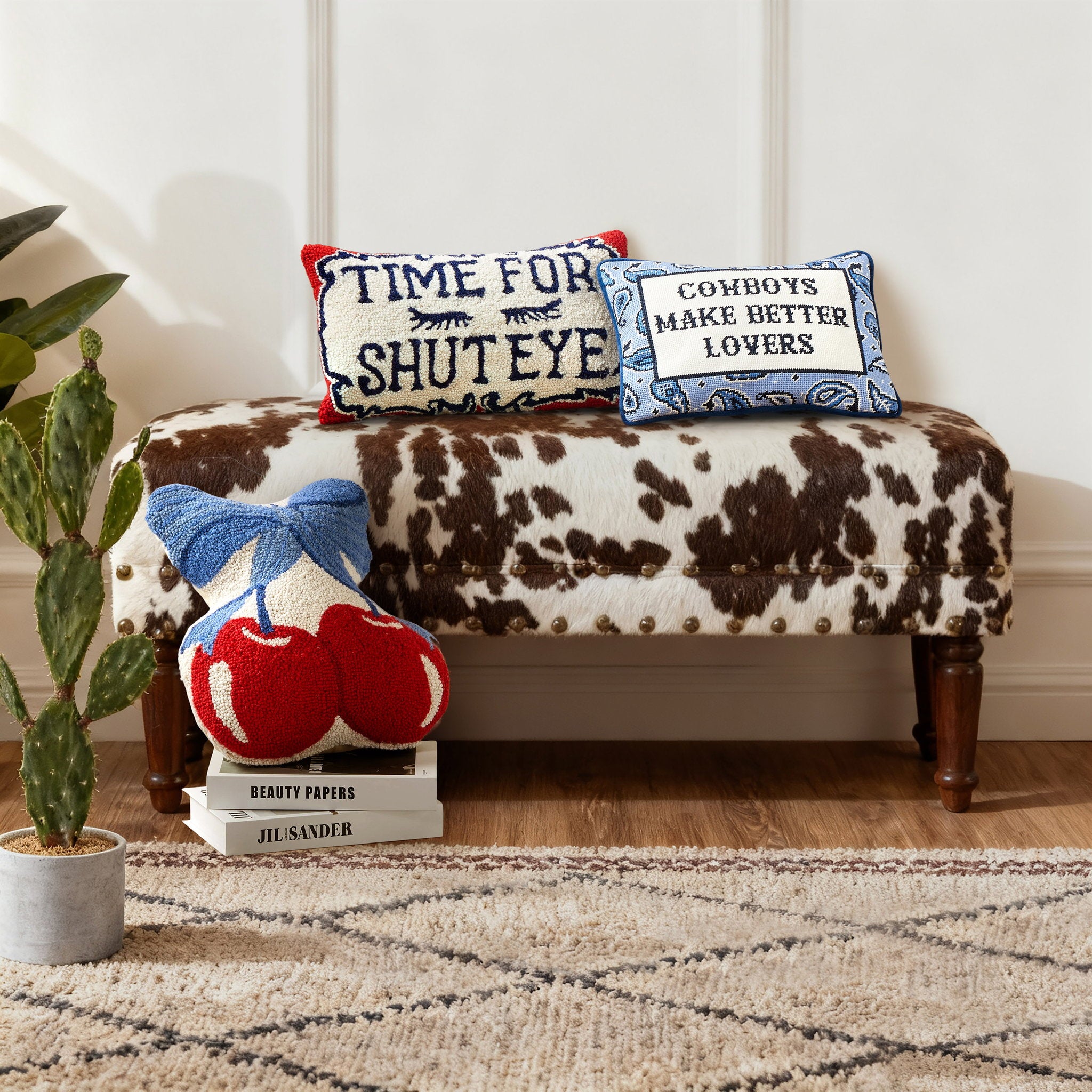Better Lovers Embroidered Needlepoint Throw Pillow shown alongside other designs in the same collection, 10x14 inch